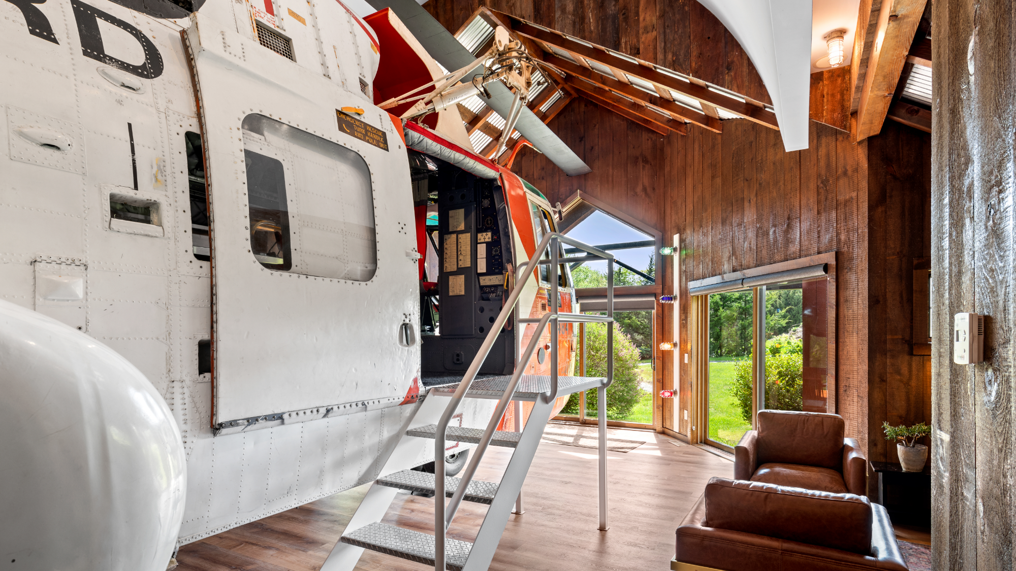 Interior of the Helicopter Cottage at Winvian Farm with an actual helicopter inside.