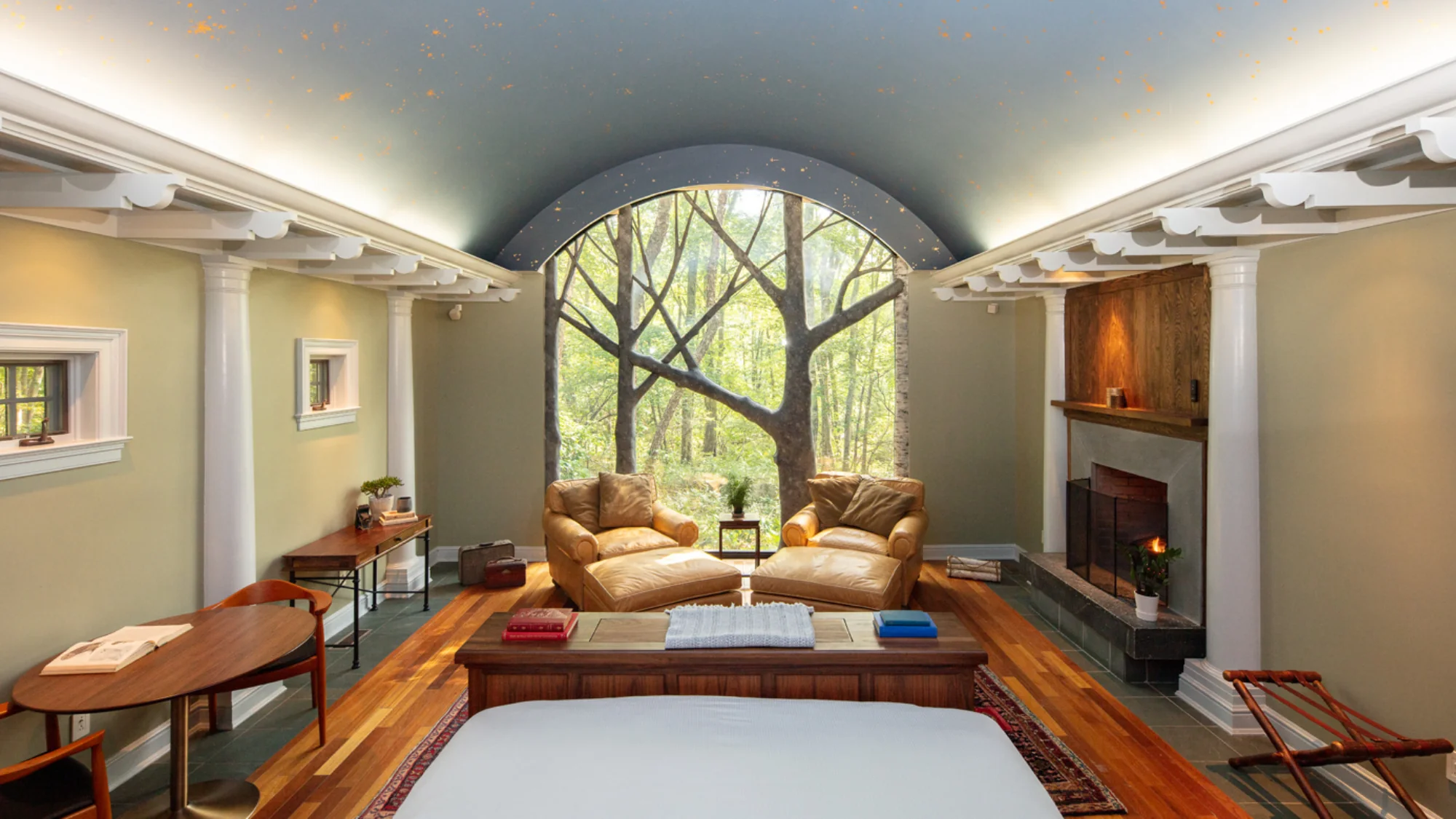 Elegant room with large window and comfortable seating at Winvian Farm.