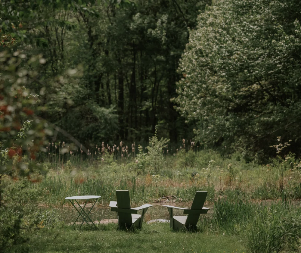 Outside seating with forest view in Winvian farm.